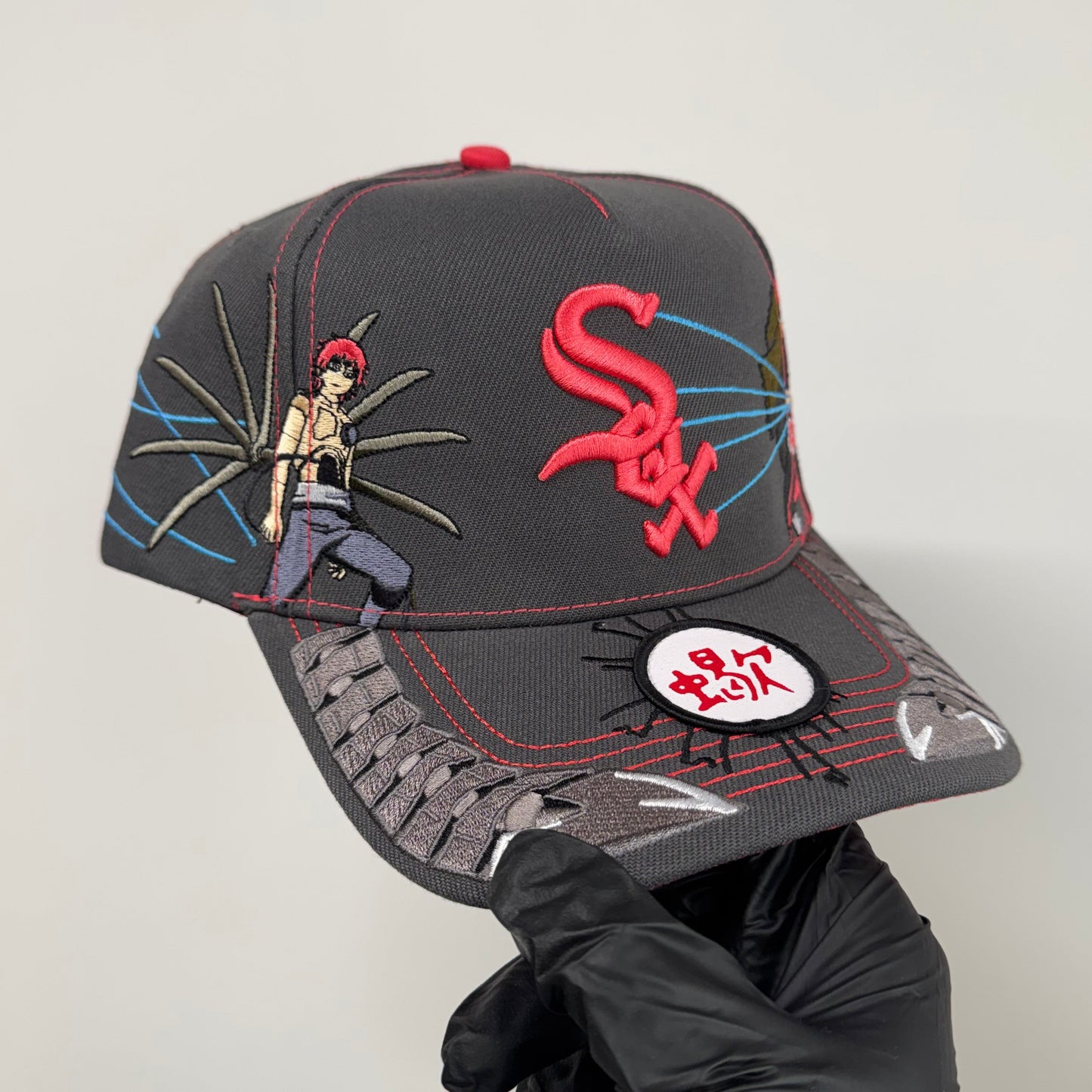 red sand puppet cap