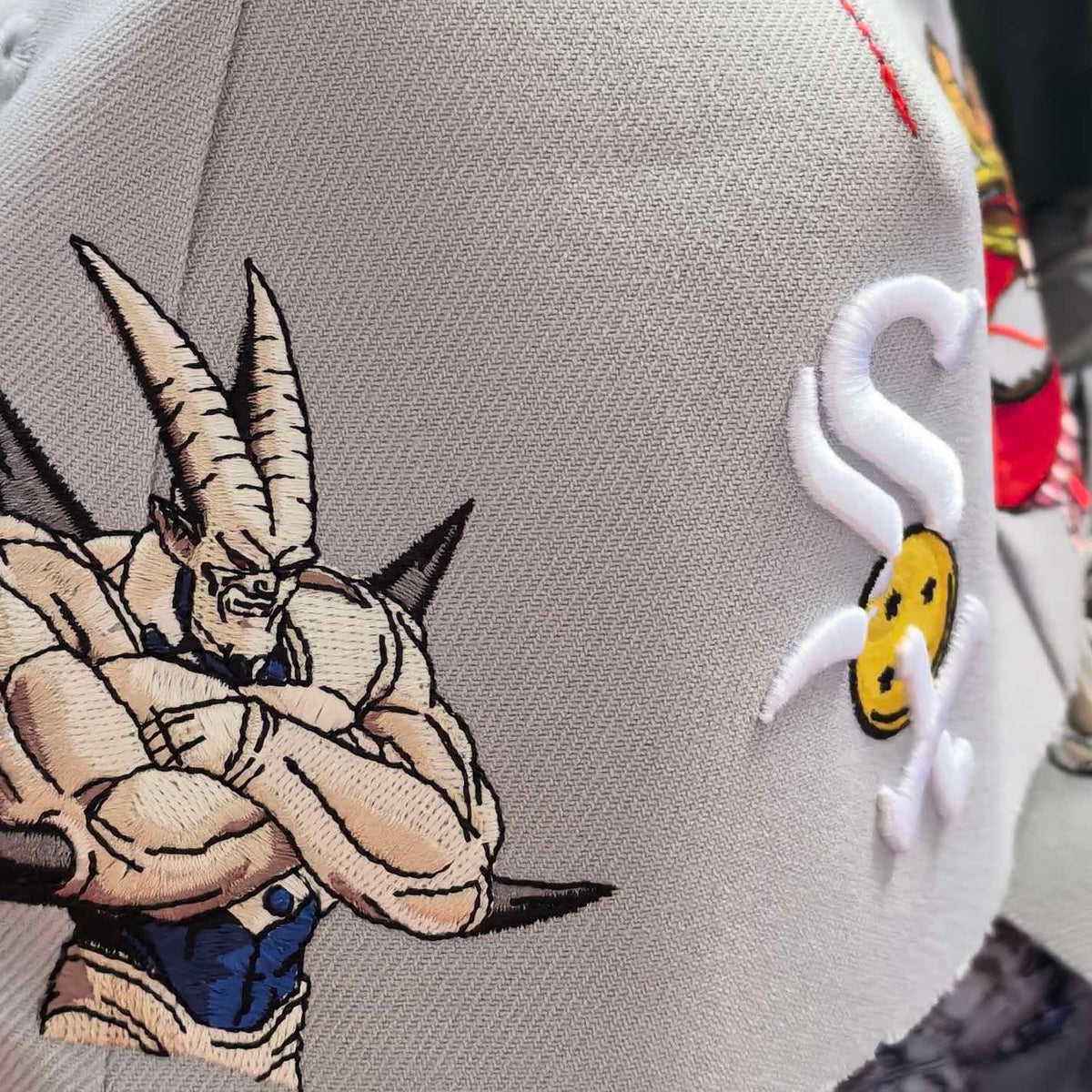 Omega cap embroidery detail